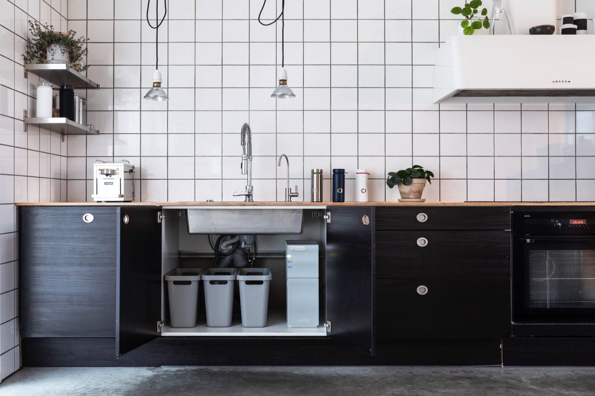 Organize all the odds and ends, small appliances, dish soap and more in the lower cabinets to free up upper cabinet shelves for food storage.