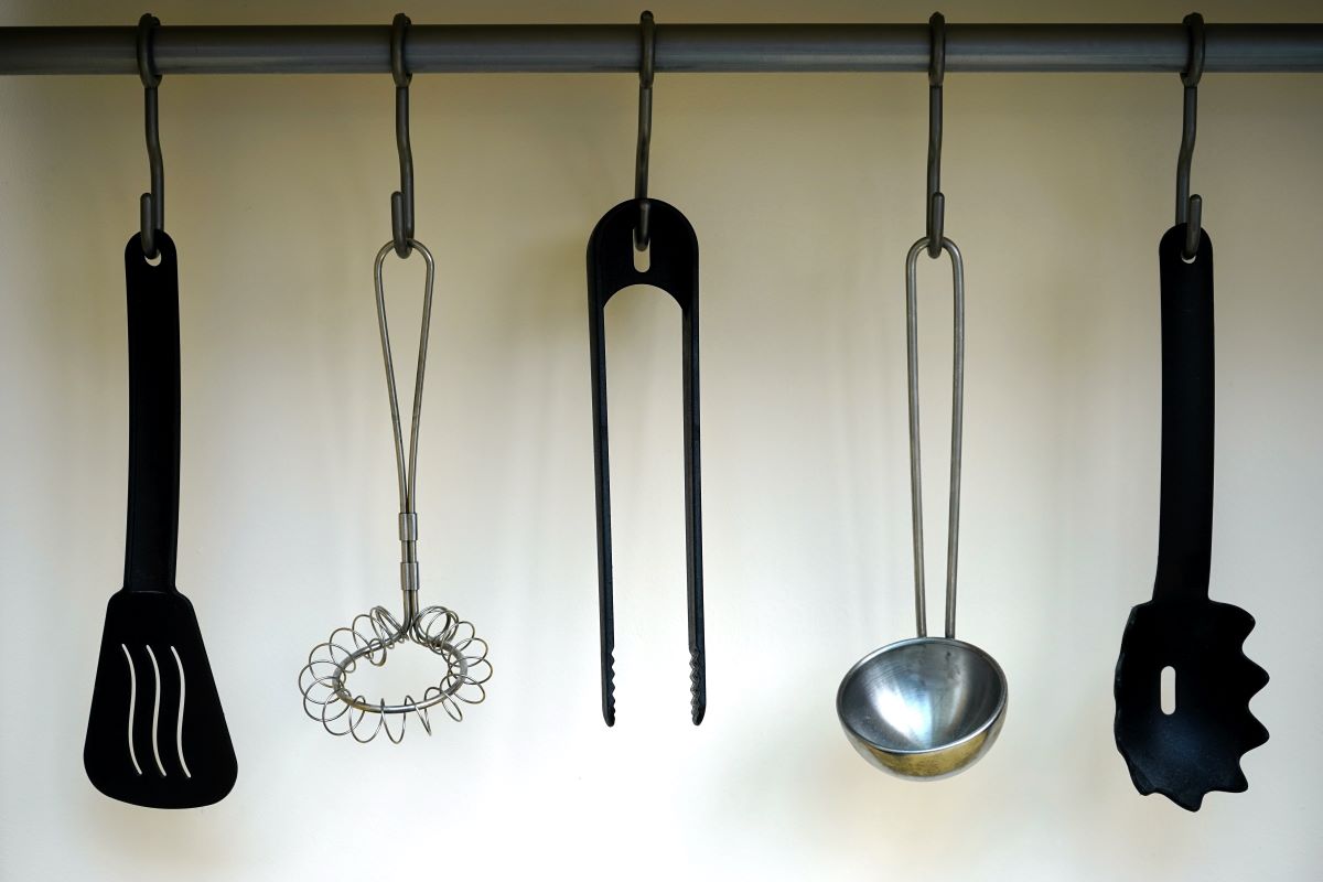 Curtain rods add flair to your interior design while helping to maintain organization of your kitchen items. 