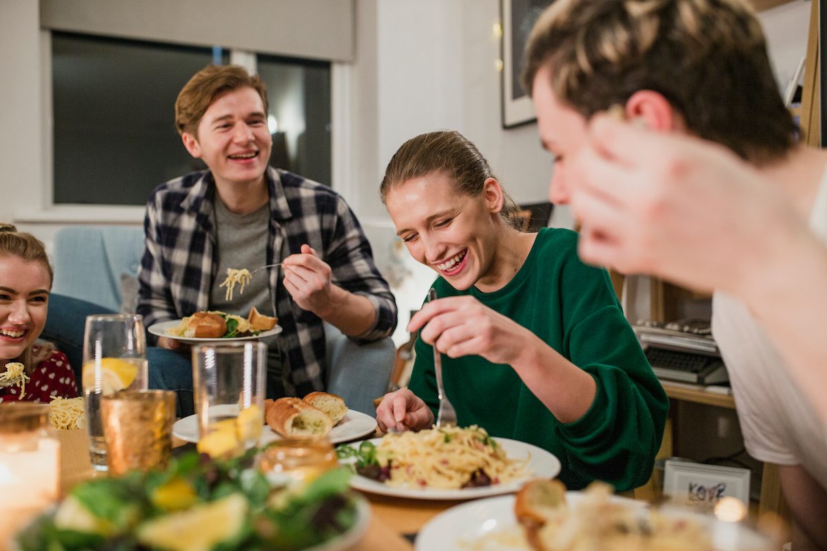 Roommate dinner among college students to celebrate a new apartment