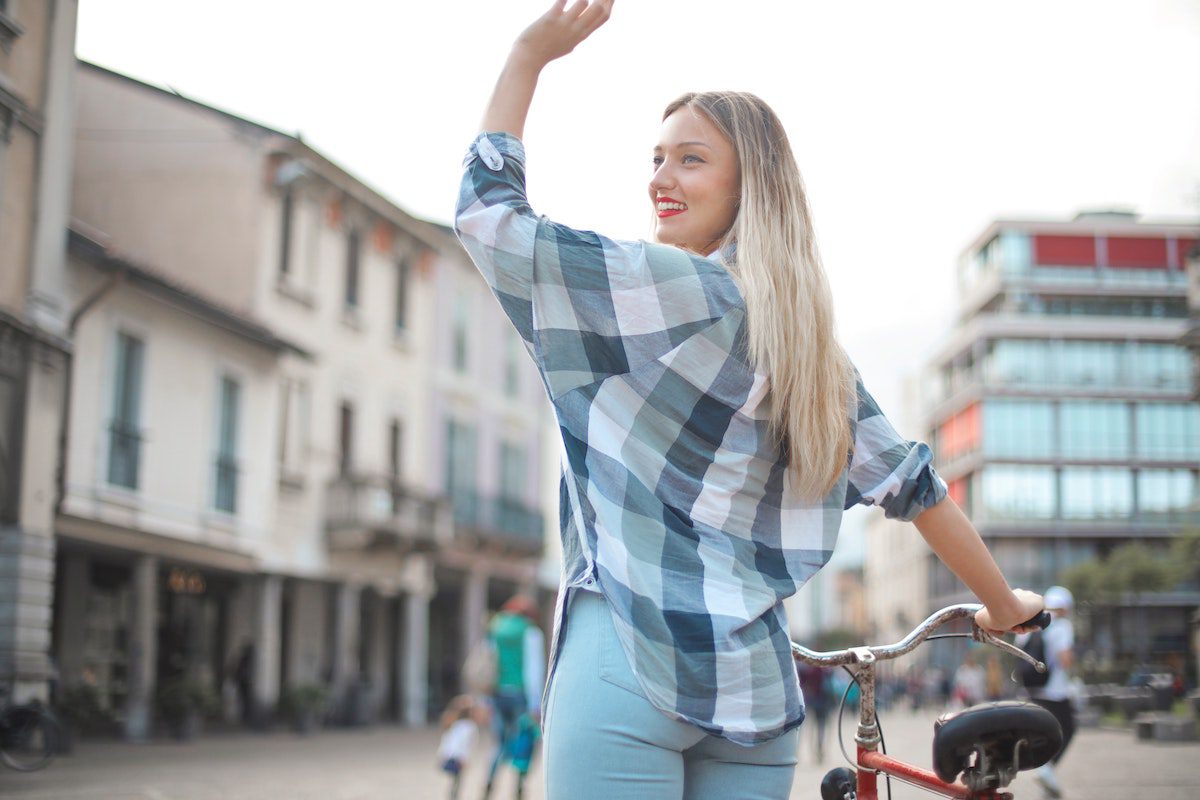 woman waving hi 